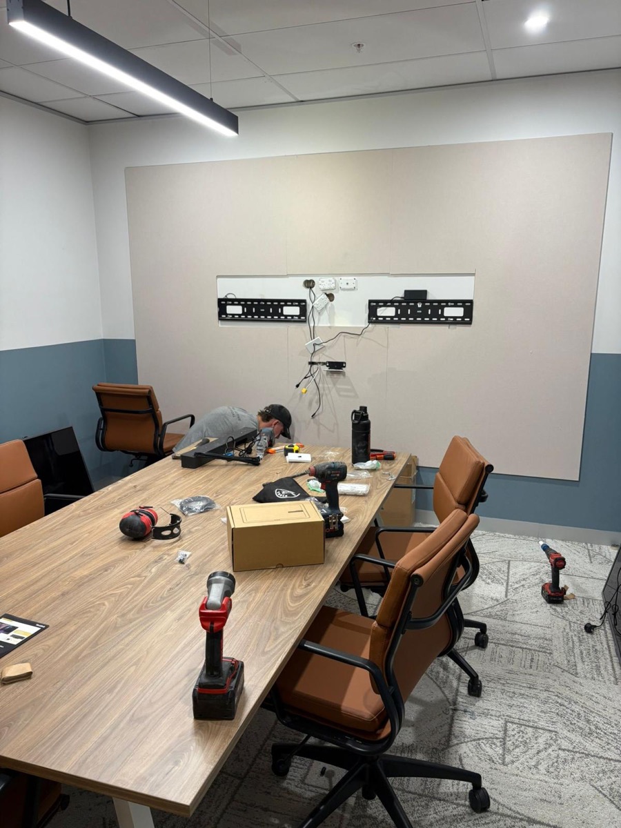 Boardroom display brackets and AV cabling during a video conferencing fit-out
